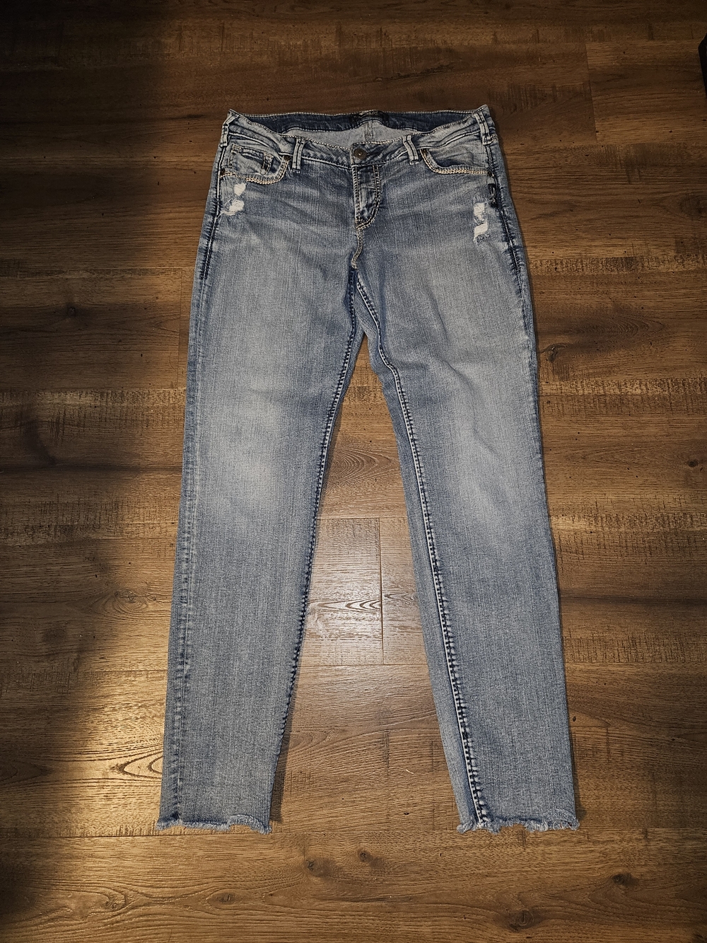 Silver Jeans Light Wash Skinny Jeans with Frayed Hems